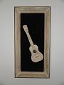 Our motel room had a framed ukelele on the wall